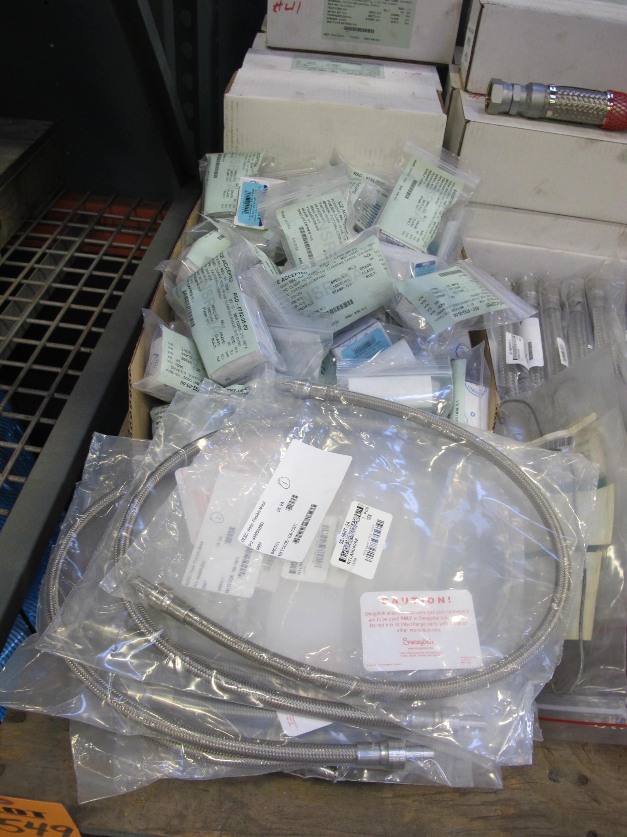 LOT TO INCLUDE: (6) SAMPLER, I/P KIND, BRASS MATERIAL, (20) HOSING SECTIONS, FLEXIBLE METAL TYPE, 1-1/2" DIAM. SIZE, MNPT X FJIC CONNECTIONS. HASTELLOY C276 CORRUGATED HOSE AND BRAID, MISC BRAIDED METAL HOSE, BOX OF HOSE CLAMPS, TUBING. LOADING & HANDLING FEE $15-4549